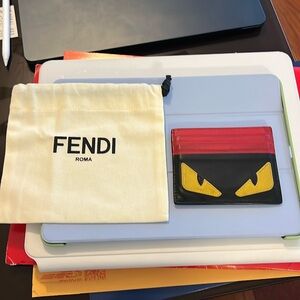 Used red and black monster Fendi card wallet.
